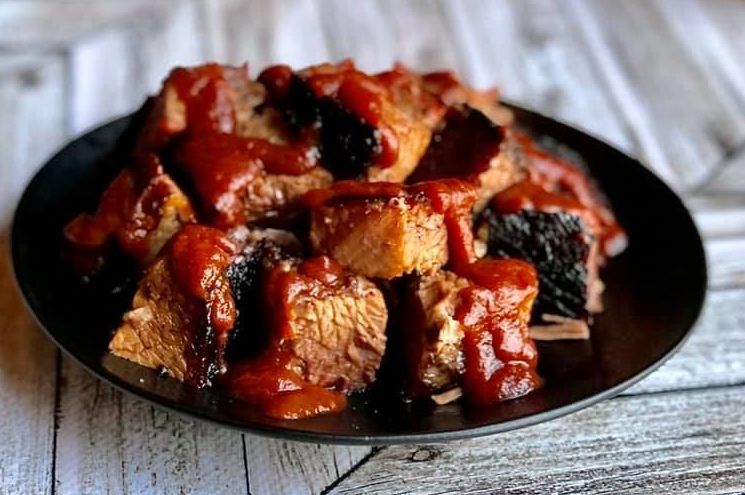 Kansas City smokehouse barbecue brisket with BBQ sauce at local BBQ restaurant