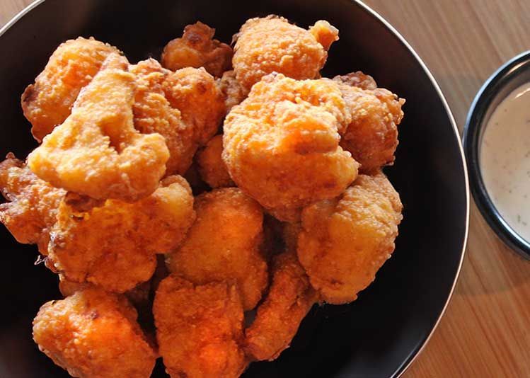 Smokehouse bbq near Kansas bowl of fried cauliflower next to a bowl of ranch dressing