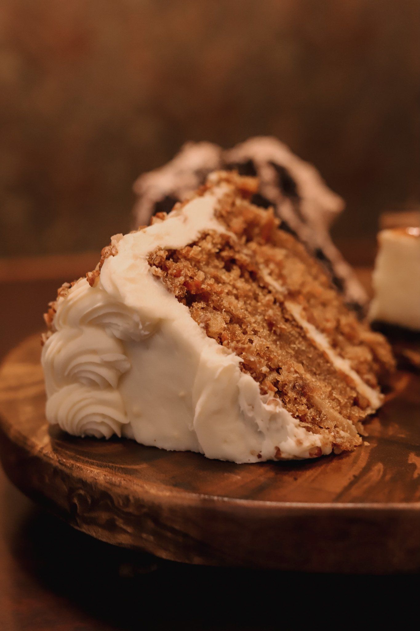 A slice of carrot cake with whipped cream in Independence Mo