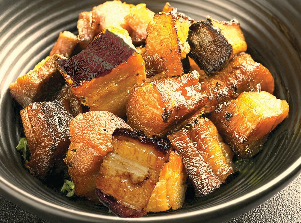 Crispy glazed pork belly cubes in a bowl at local bbq restaurant
