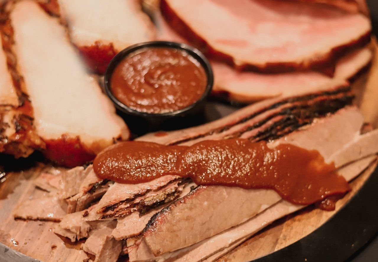 Sliced meat and sauce at Kansas City Smokehouse bbq restaurant