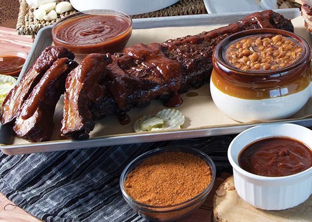 Smokehouse bbq meat and two bowls of sauce.