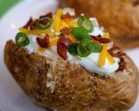 Baked potato with sour cream , cheese , bacon and green onions near me