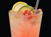 Refreshing cocktail with cherry, lime, and lemon garnish at smokehouse barbecue near me