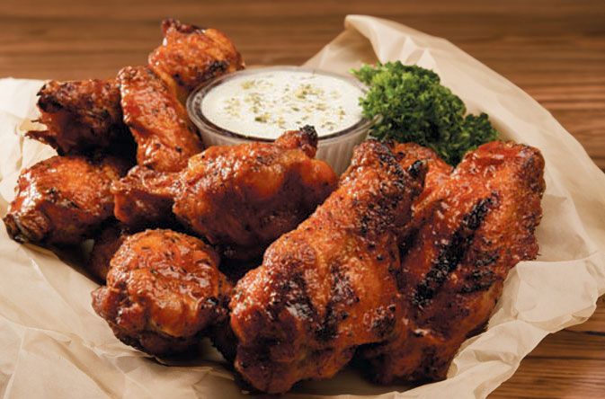 Smokehouse BBQ chicken wings and a dipping sauce near me
