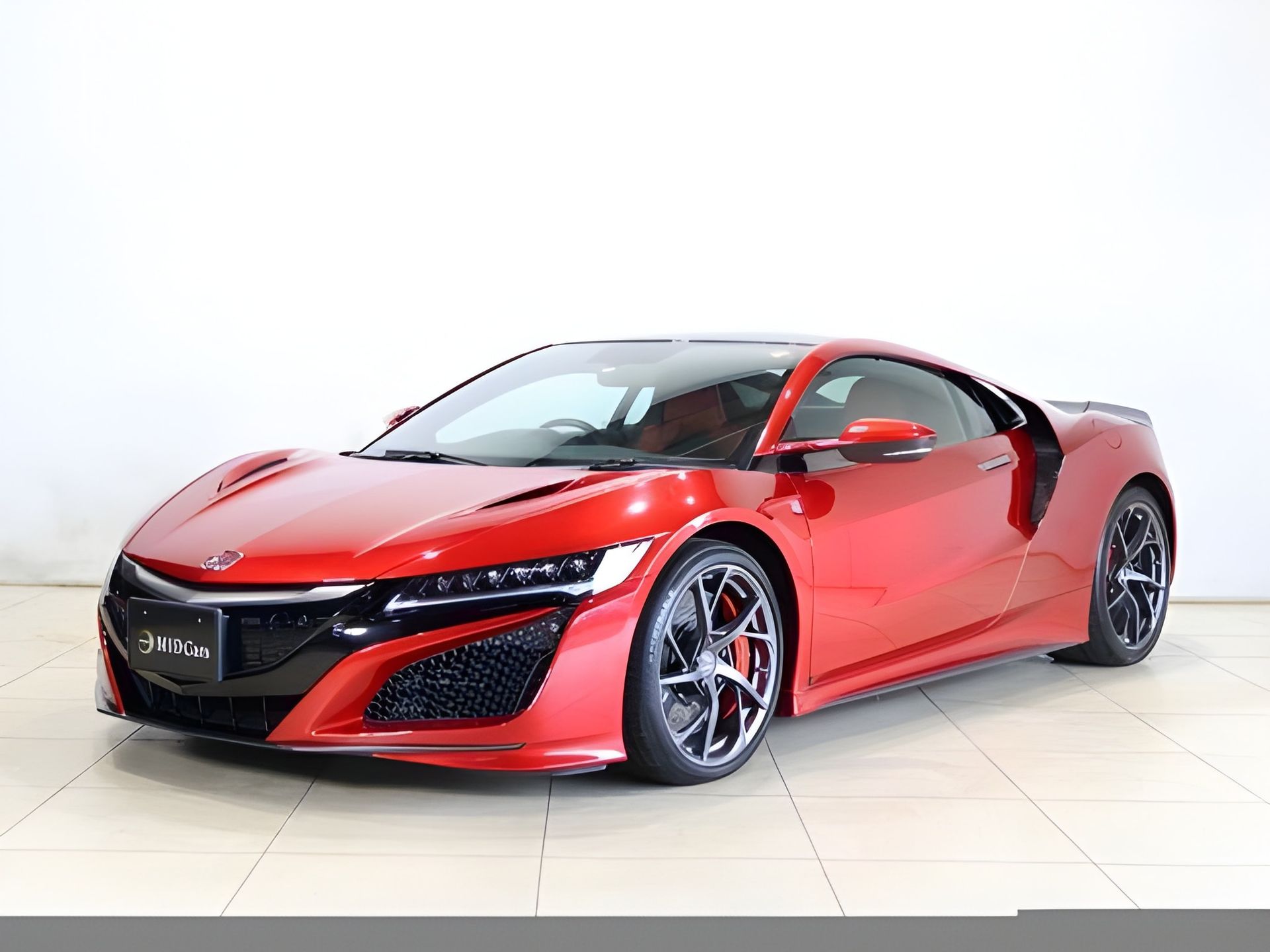 Red Honda NSX sports car, front view, with black accents.