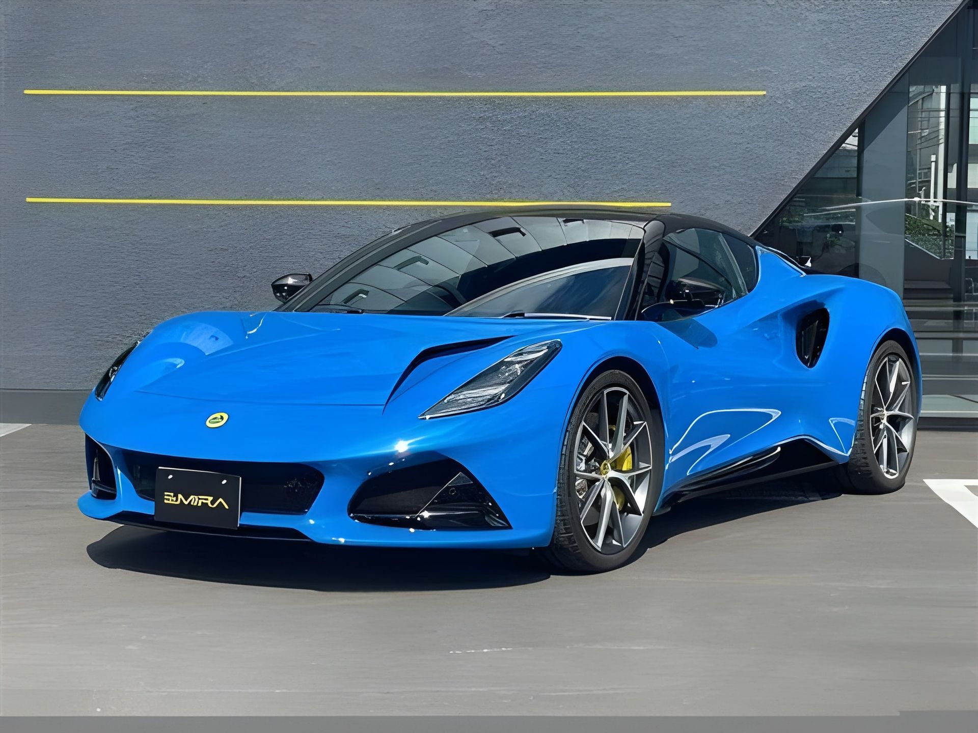 Blue Lotus Emira sports car parked in front of a building.