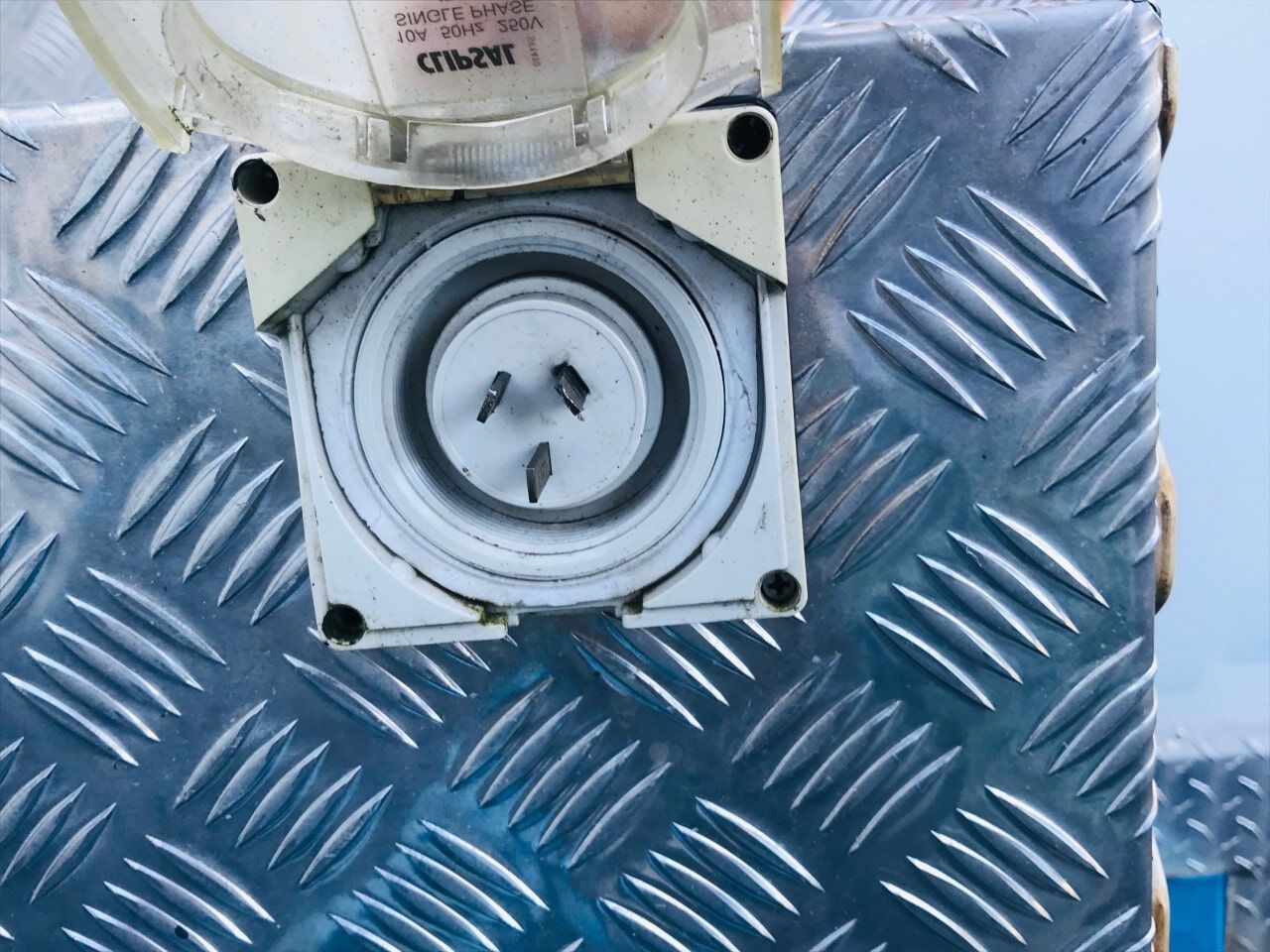 A Close up of a Electrical Outlet on a metal Surface - Cool Room in Lindendale, NSW