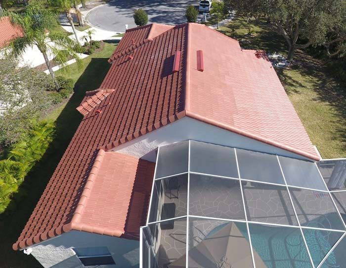 An aerial view of a house with a red tiled roof
