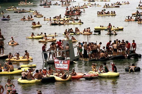 Image of the Great Ramblin' Raft Race, participants on rafts in the Chattahoochee River