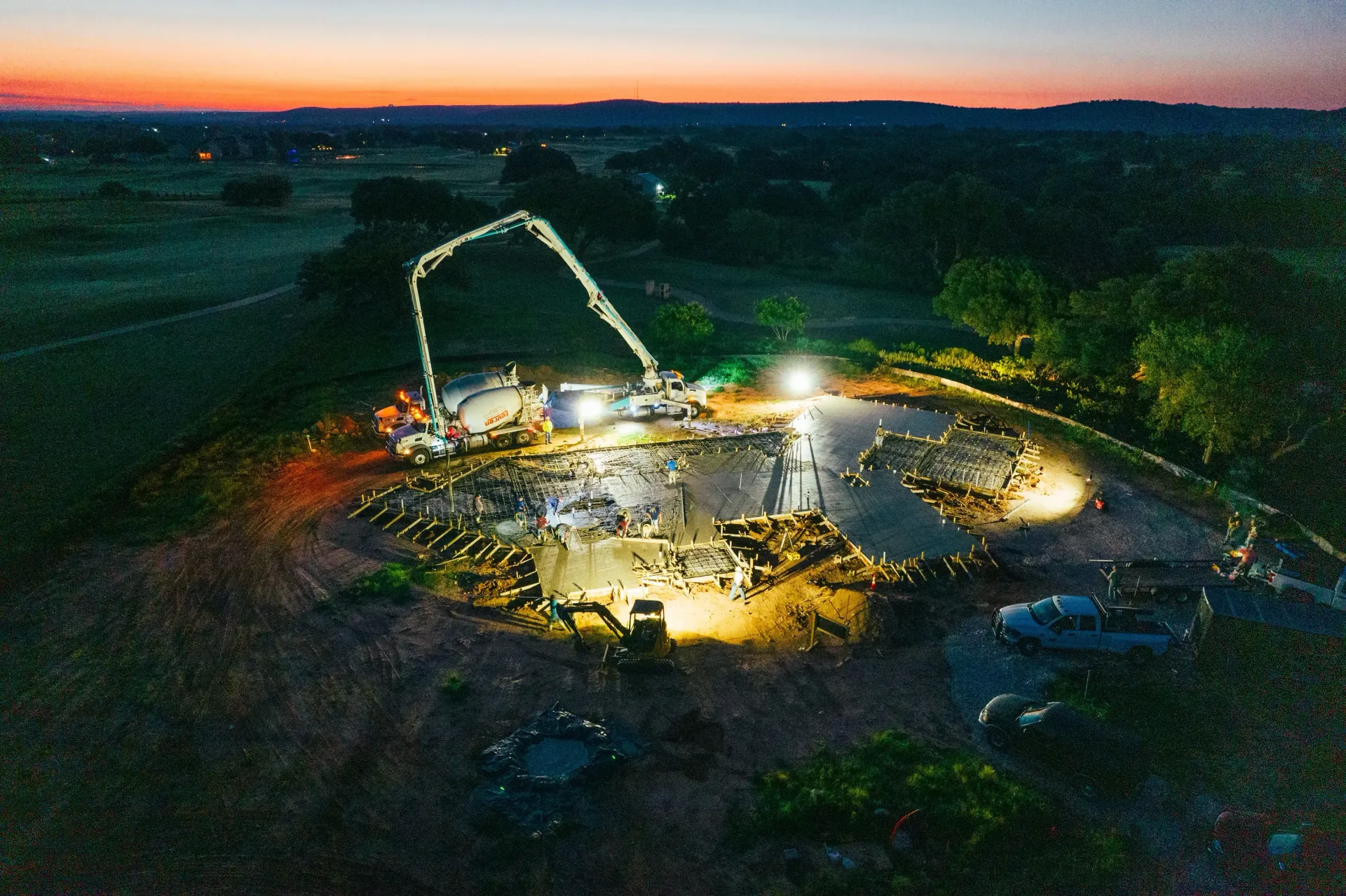 An aerial view of a construction site at night.