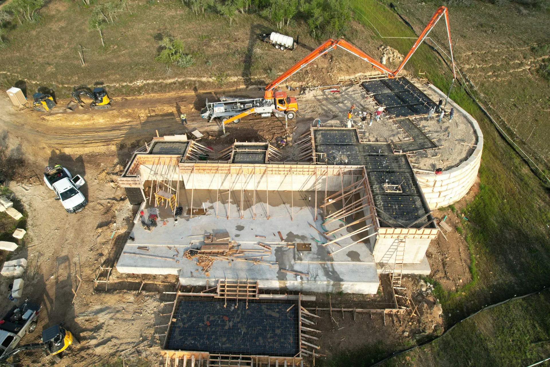 An aerial view of a large building under construction