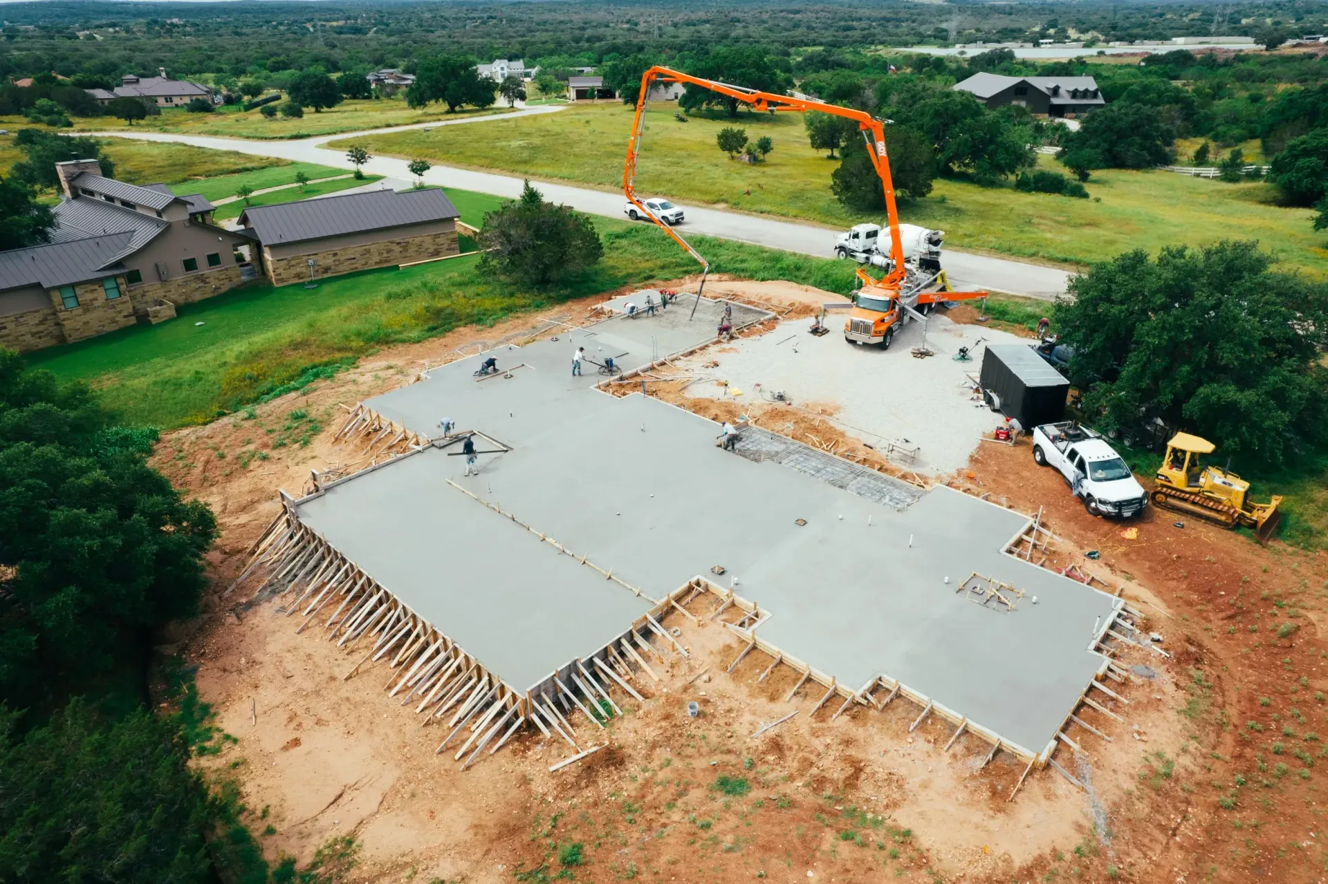 An aerial view of a concrete base for a house under construction.