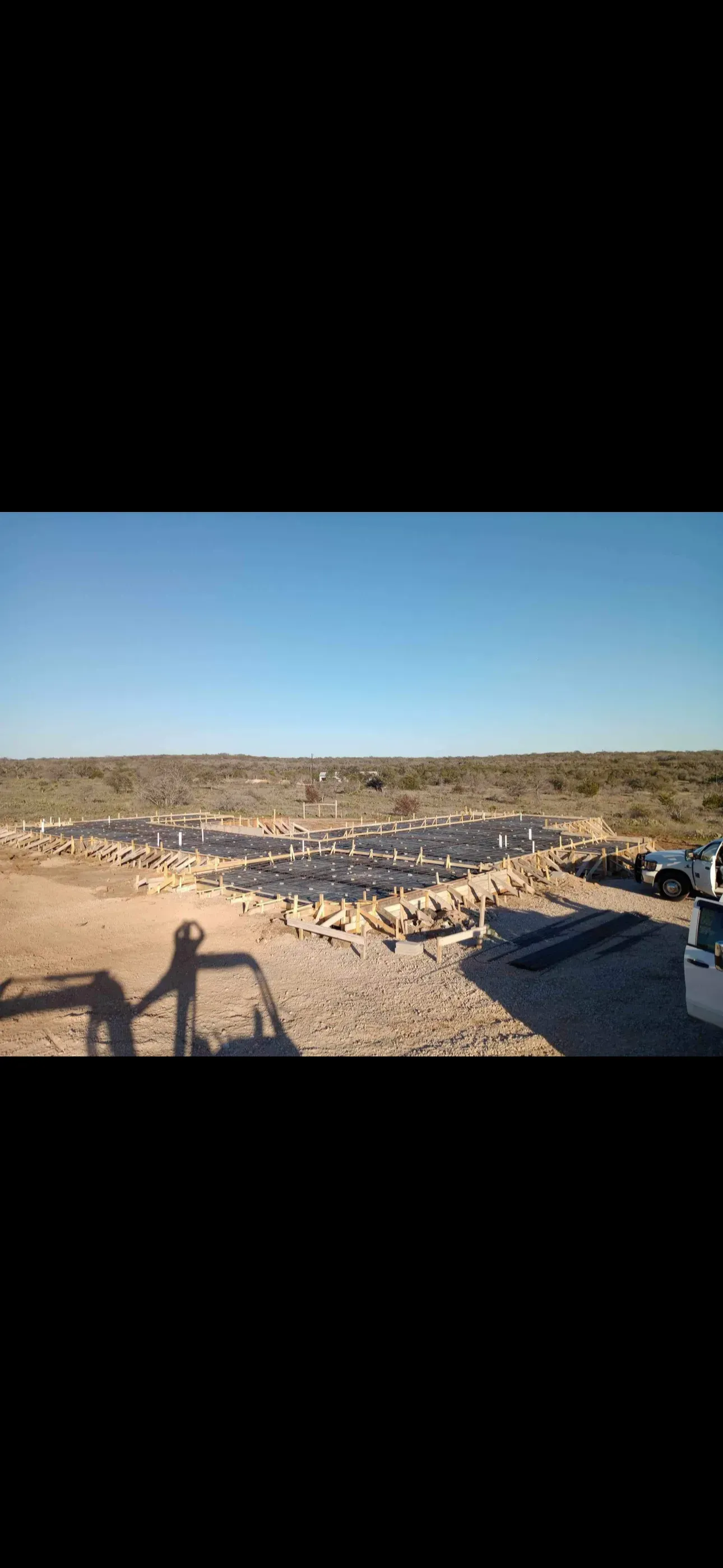 A large body of water is being built in the middle of a desert.