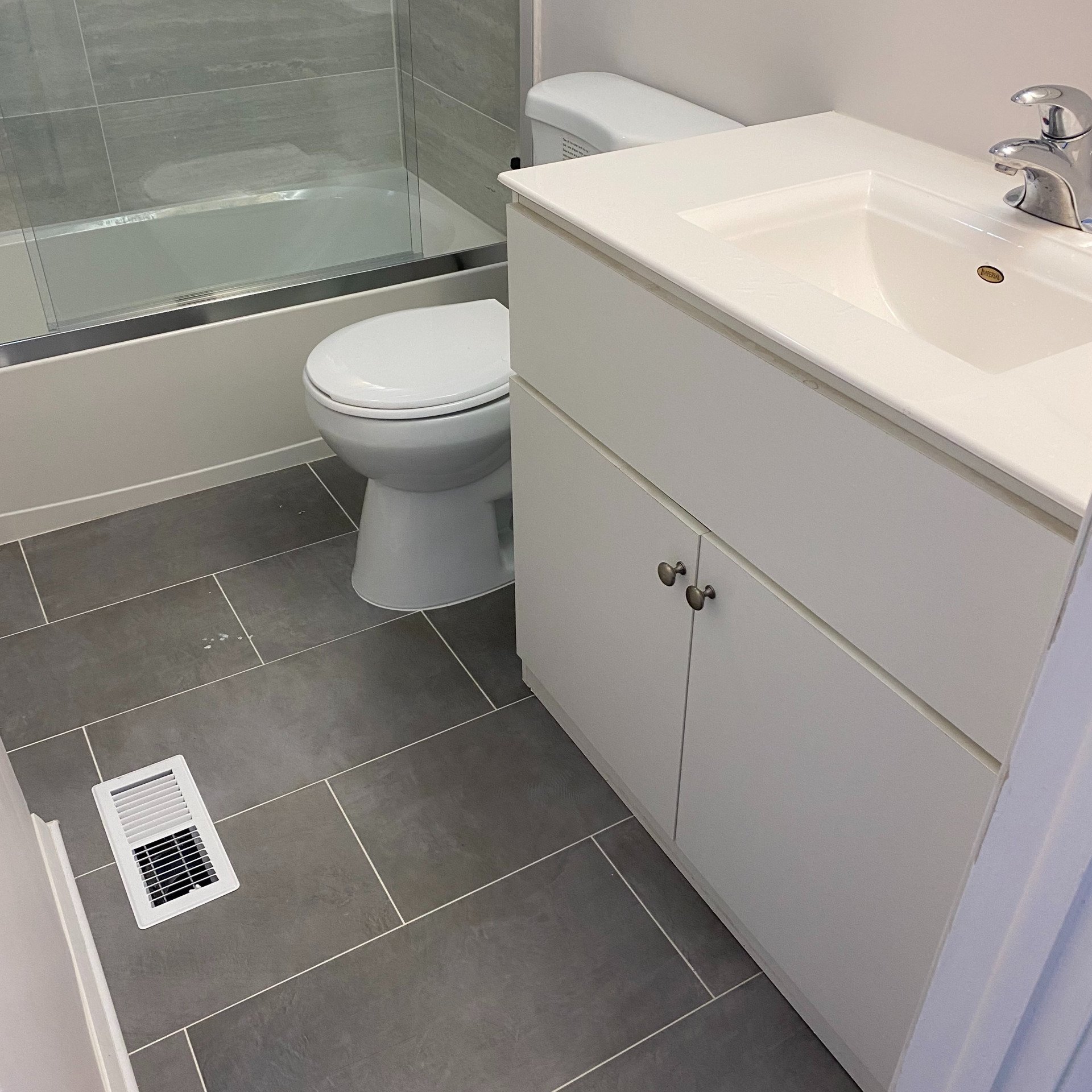 Bathroom Flooring and Sink With Cabinet