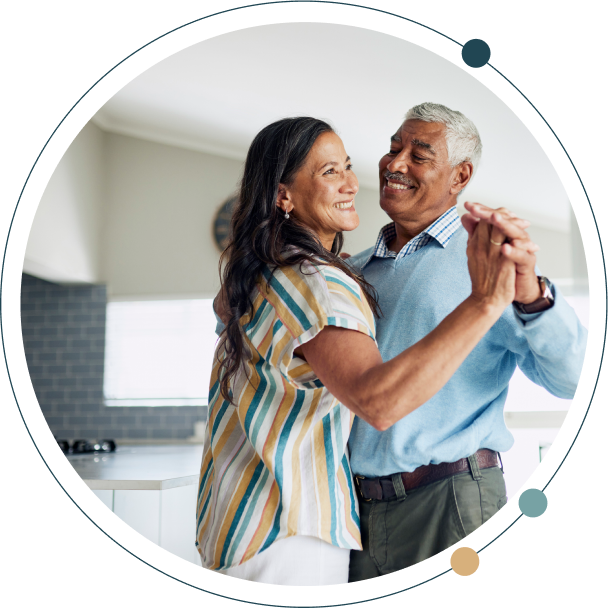 Grandmother and her granddaughter baking together in the kitchen.