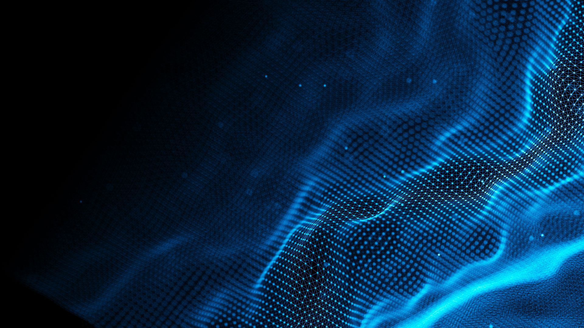 Woman with headset gives thumbs up, smiling in office; colleagues in background.