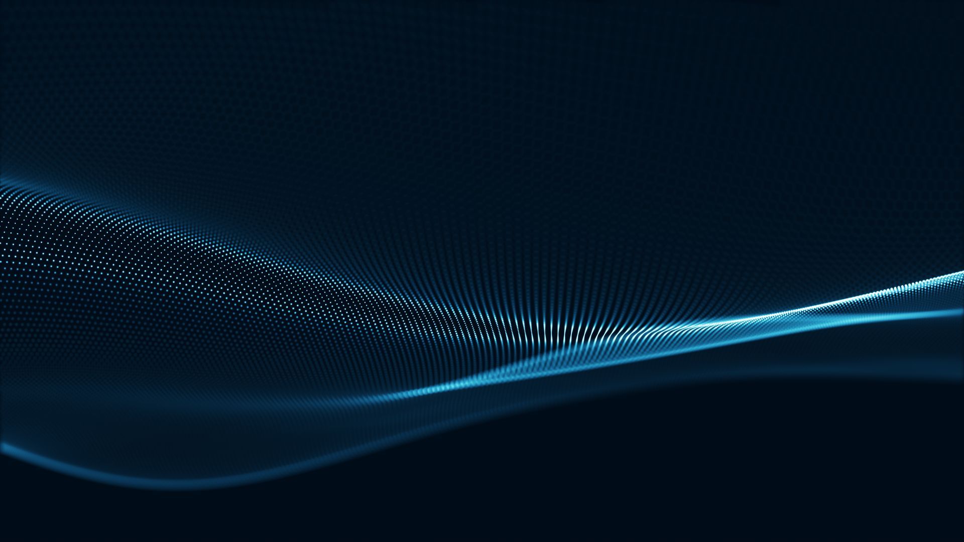 People in a call center wearing headsets; a Black man smiles while speaking into a microphone.