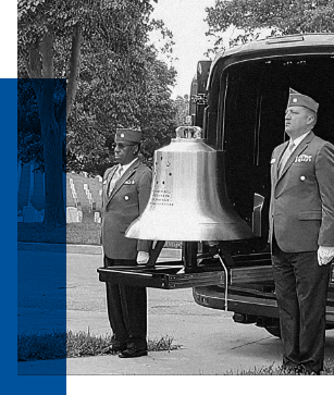 Two uniformed service members stand beside a large brass bell, delivering Bell Honors at a veteran's funeral