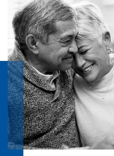 Elderly couple embracing and smiling, representing peace of mind through funeral preplanning services and thoughtful end-of-life planning for loved ones.