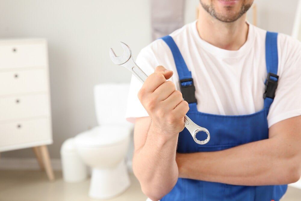 Plumber with Wrench — Brian Cook Plumbing in Coffs Harbour, NSW