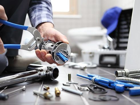 A Plumber Uses Tools — Brian Cook Plumbing in Coffs Harbour, NSW