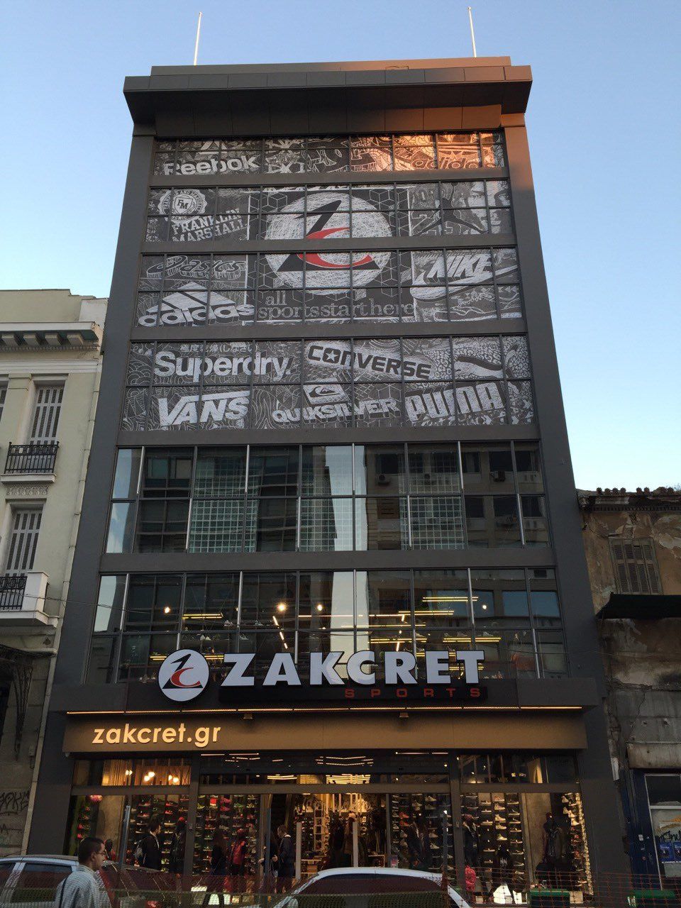 Zakcret shoe store in a tall building. Main signage and brand logos visible.