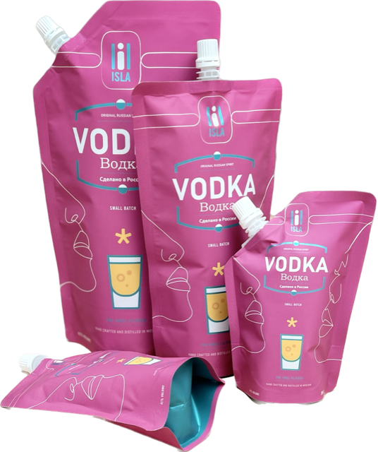 Three bags of vodka are sitting next to each other on a table.