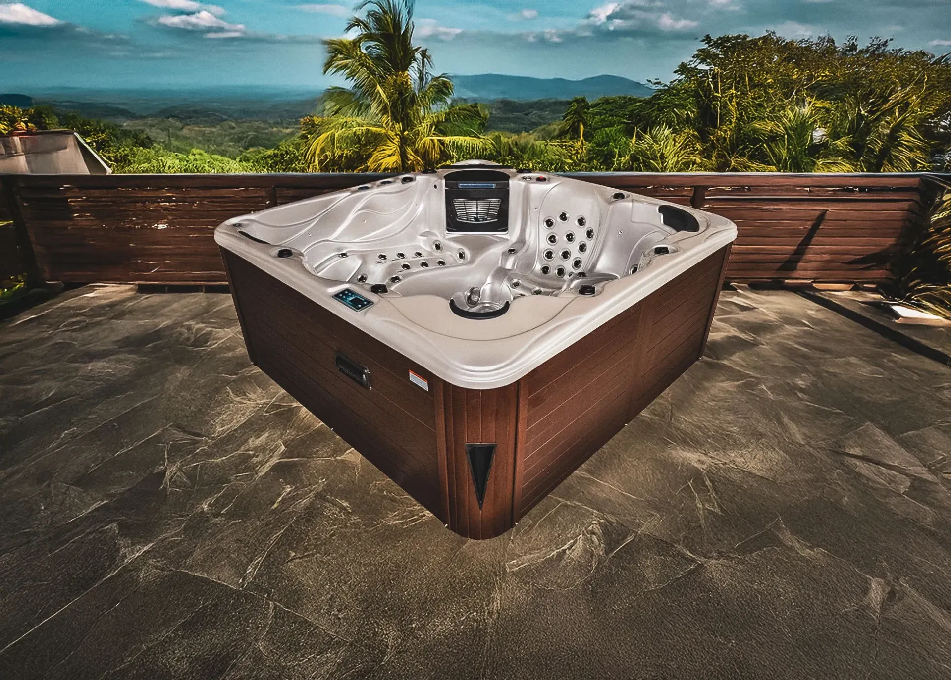 Un spa est installé sur une terrasse avec vue sur les montagnes