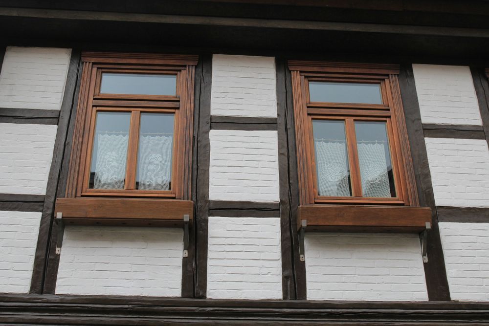 Two Wooden-framed Windows in a White Brick Wall With Dark Wooden Beams — Working Windows in Byron Bay, NSW
