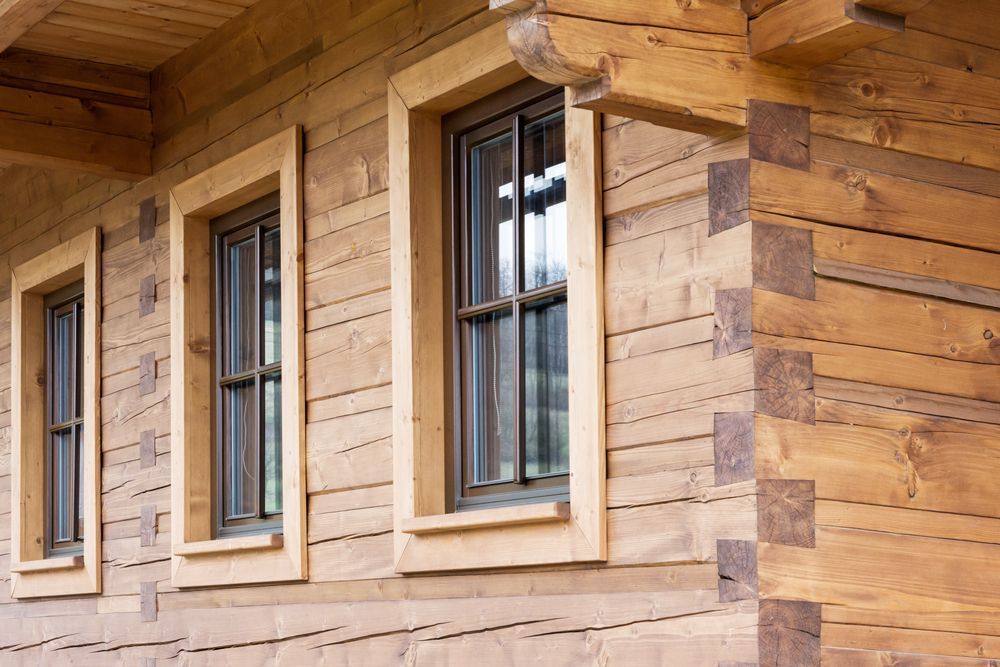 Three Wood-framed Windows With Dark Frames in a Wood Log Cabin — Working Windows in Lennox Head, NSW