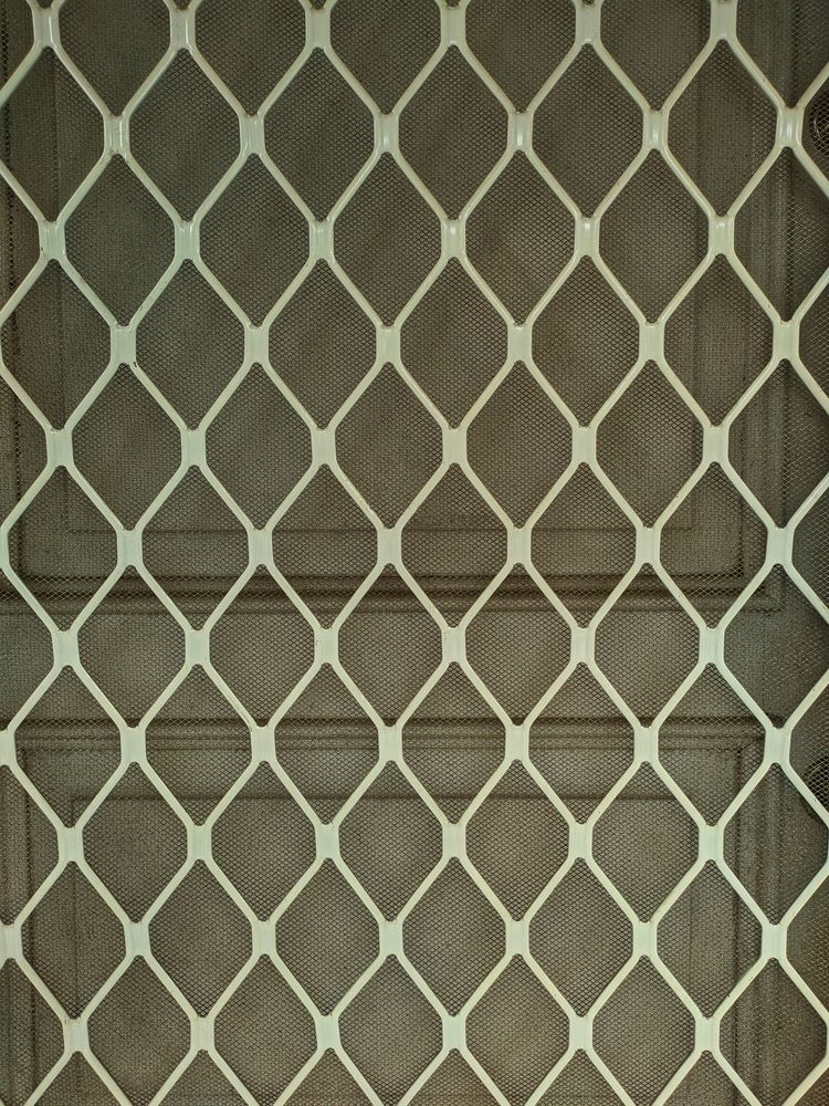 White Diamond-patterned Security Screen Door on a Brown Wooden Door — Working Windows in Lennox Head, NSW