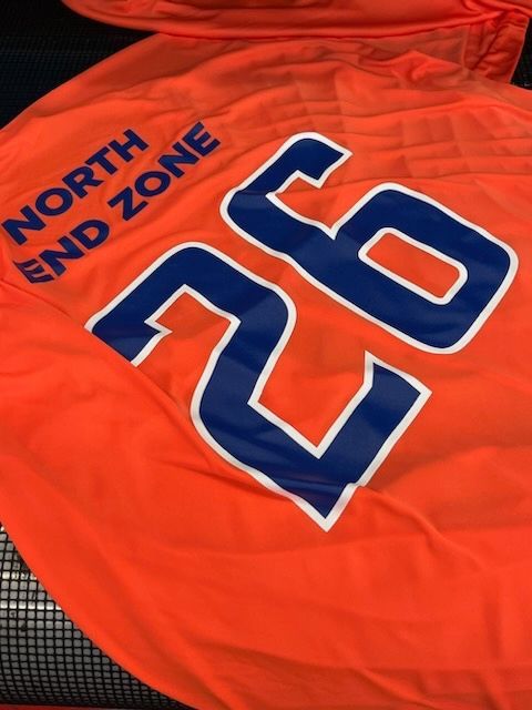 Orange flag with blue text: 