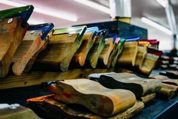 Colorful squeegees lined up, ready for screen printing, various colors and angles.