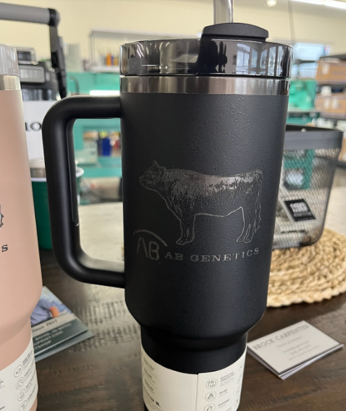 Black travel mug with handle, etched bull design, 