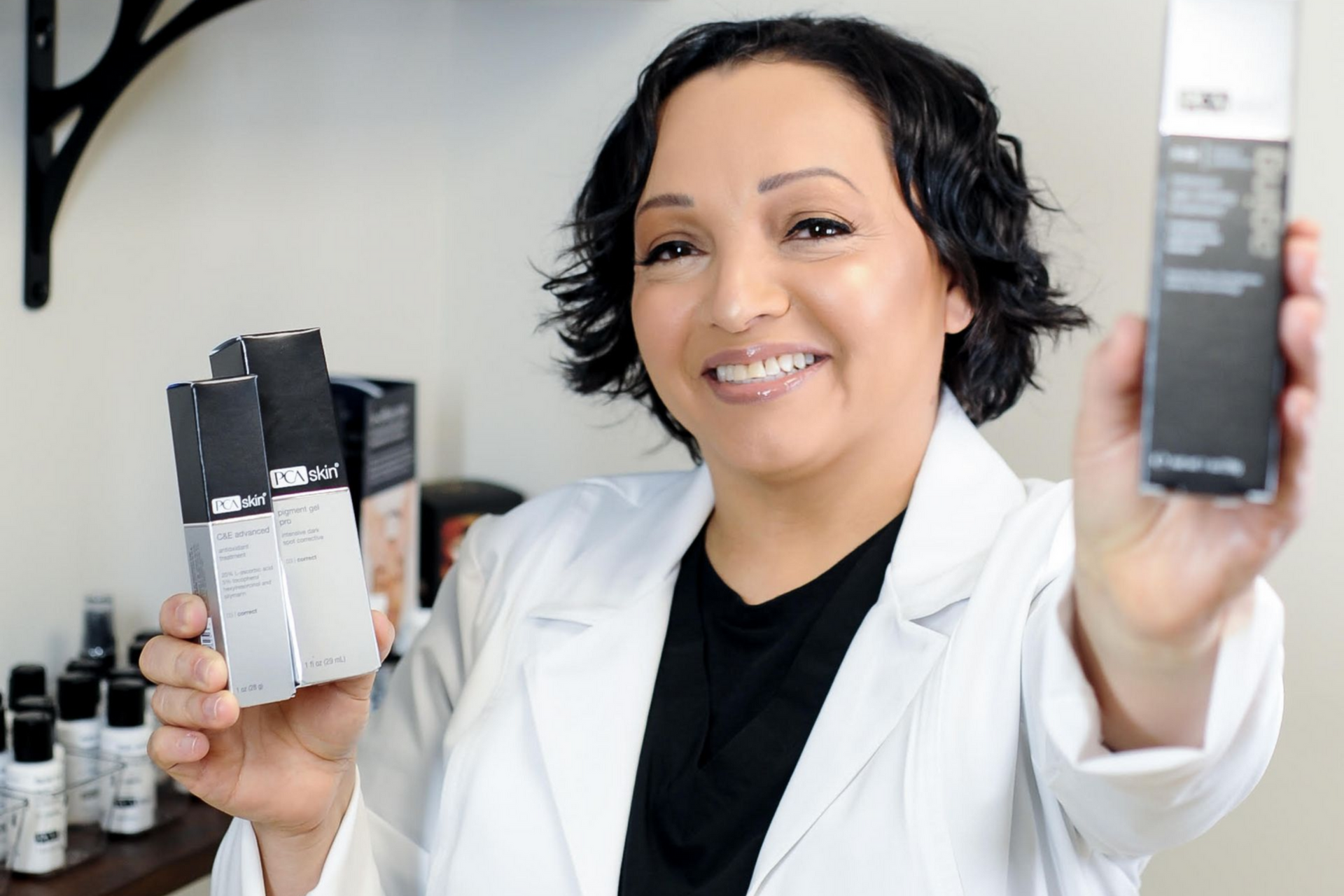 A man is giving a gift to a woman who is sitting on a couch.