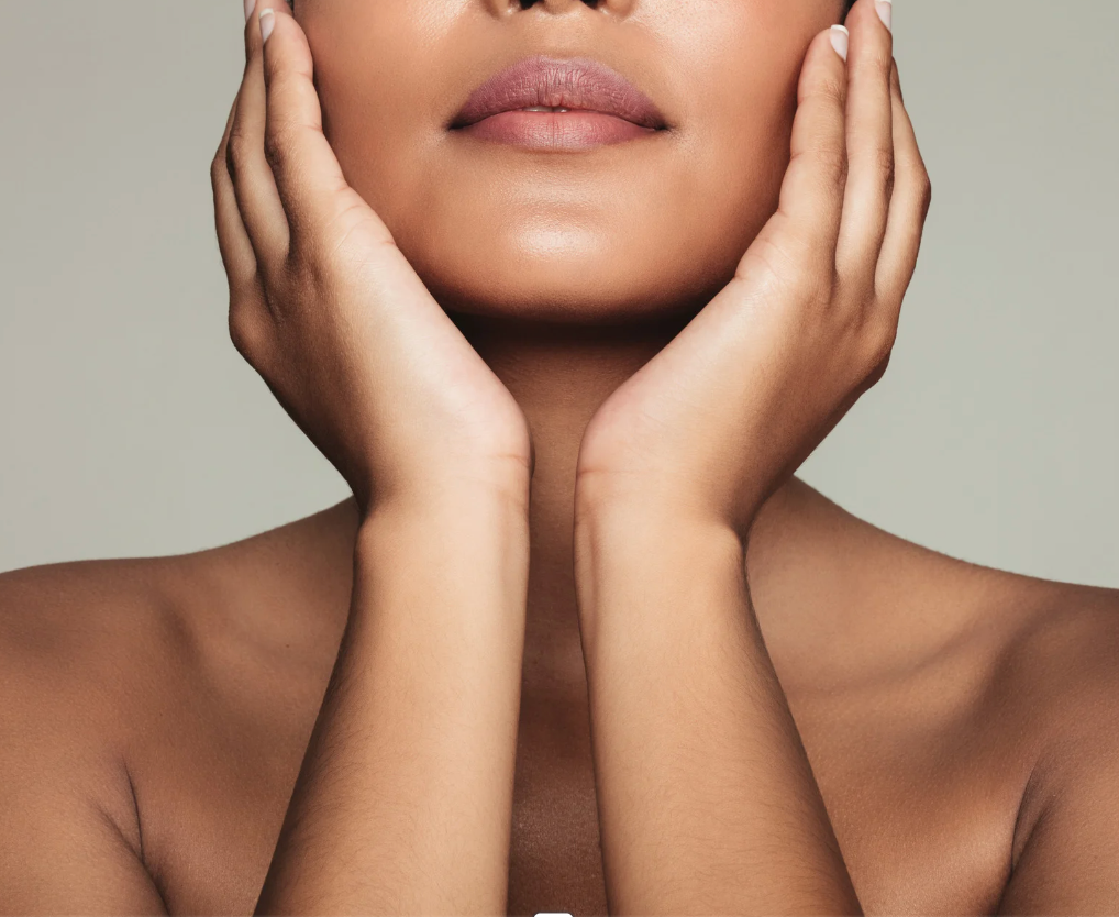 A woman is getting a laser hair removal treatment on her arm.