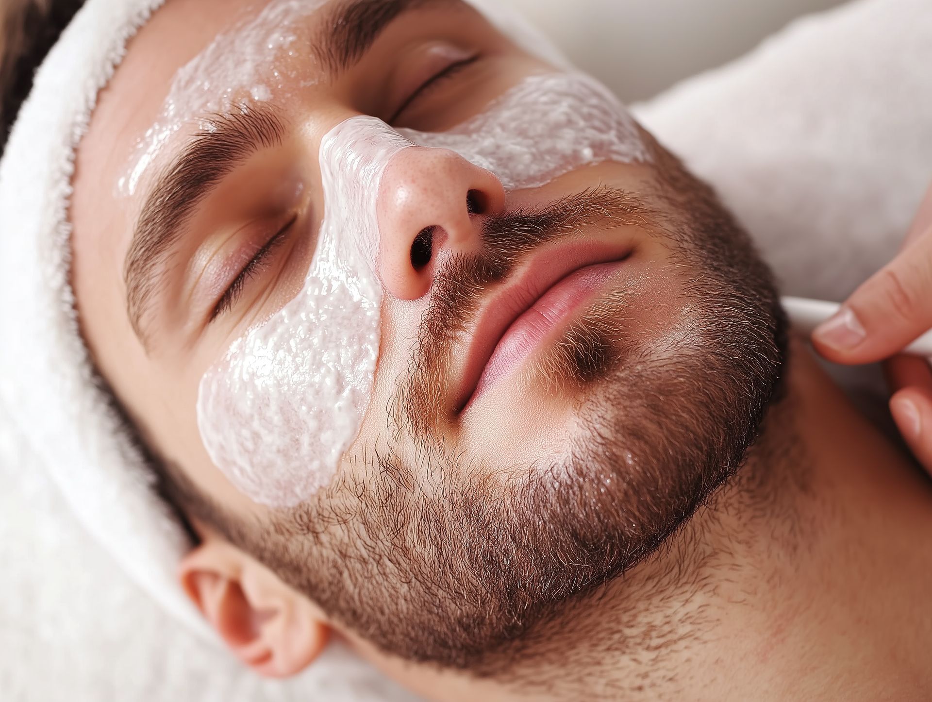 A woman is getting a facial treatment at a spa.