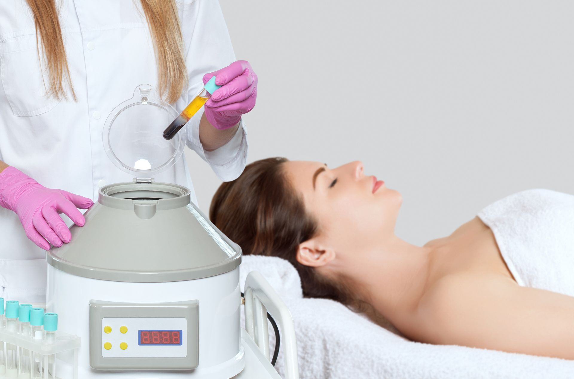 A woman is getting a plasma treatment in a beauty salon.