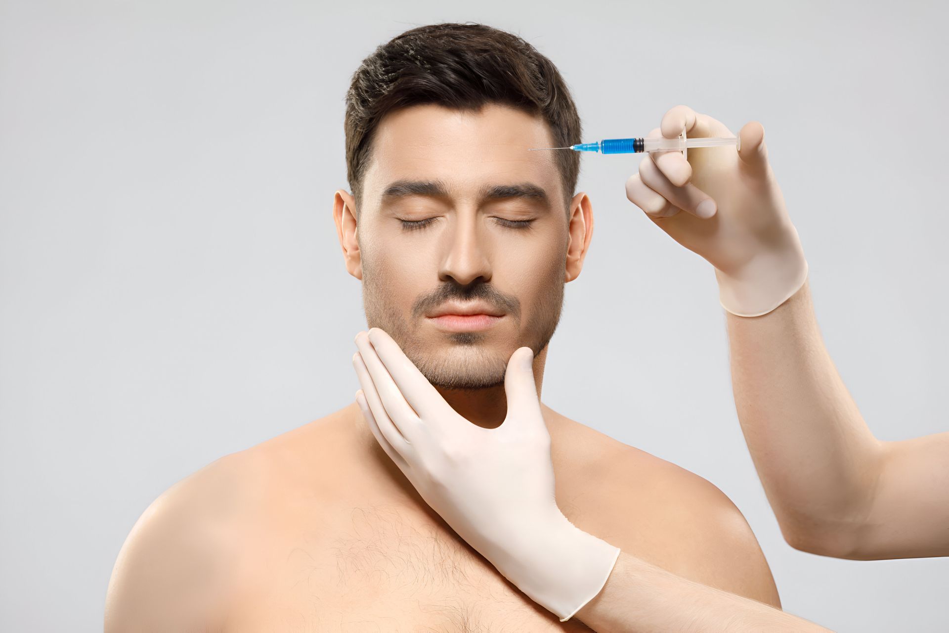 A close up of a woman getting an injection in her face