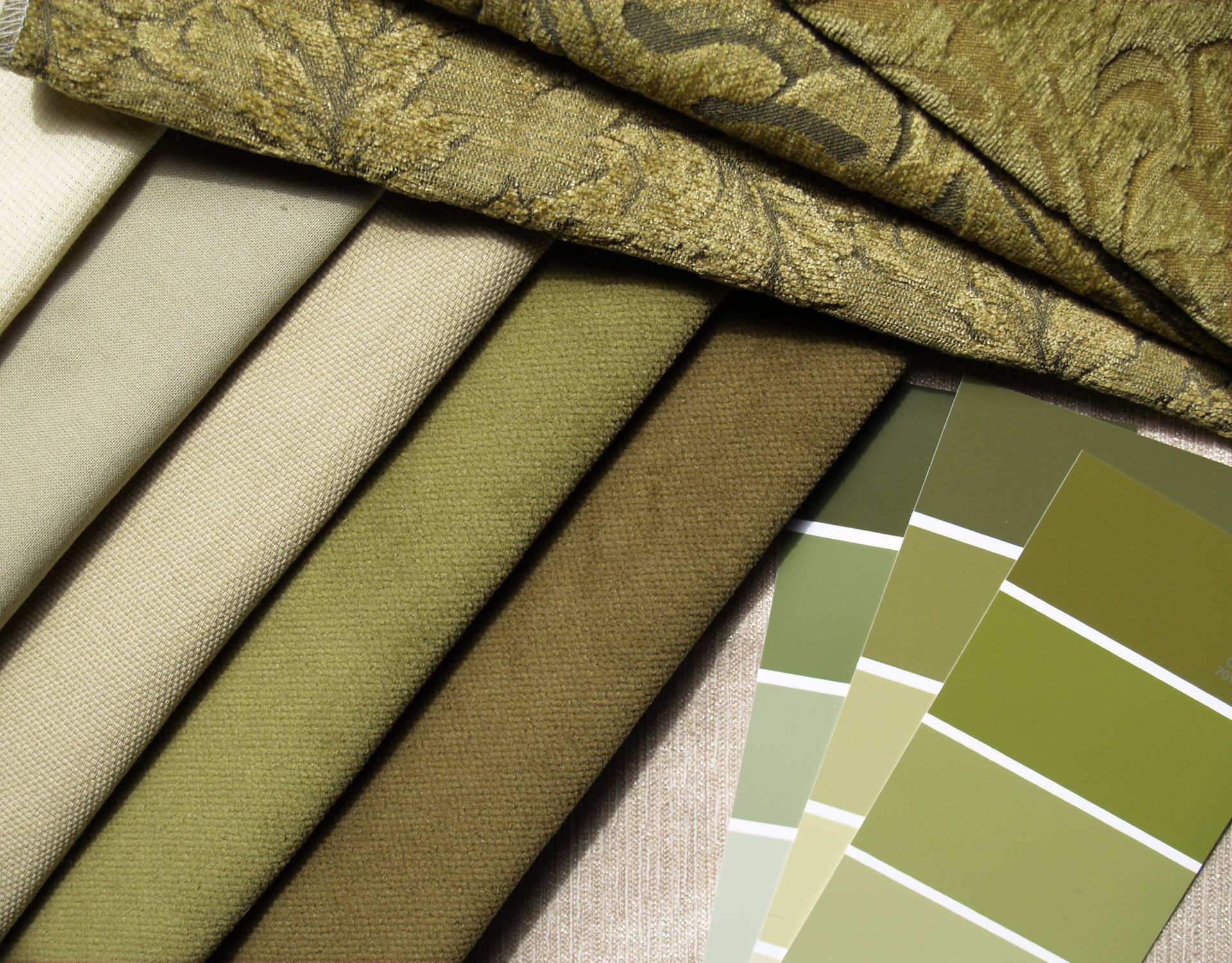 A variety of green luxury fabrics with color-matching tools near Lockport, NY
