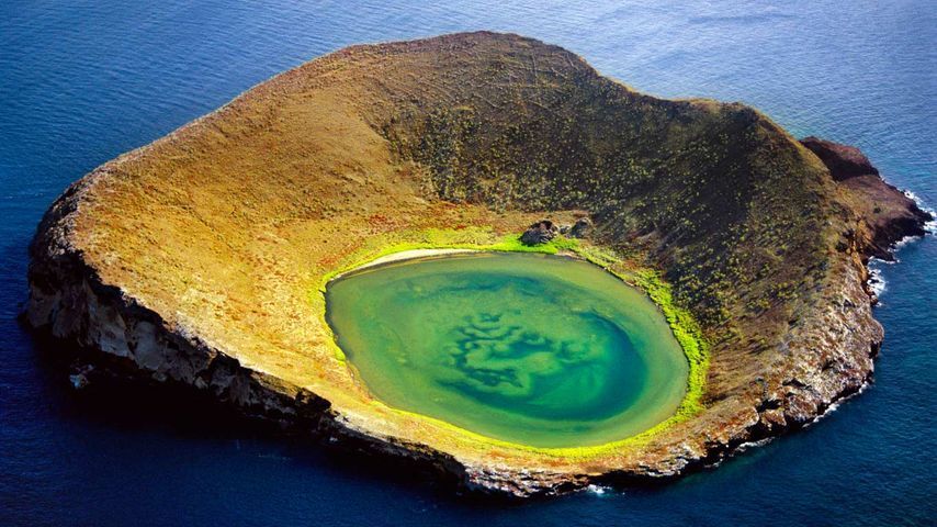 An aerial view of a small island in the middle of the ocean.