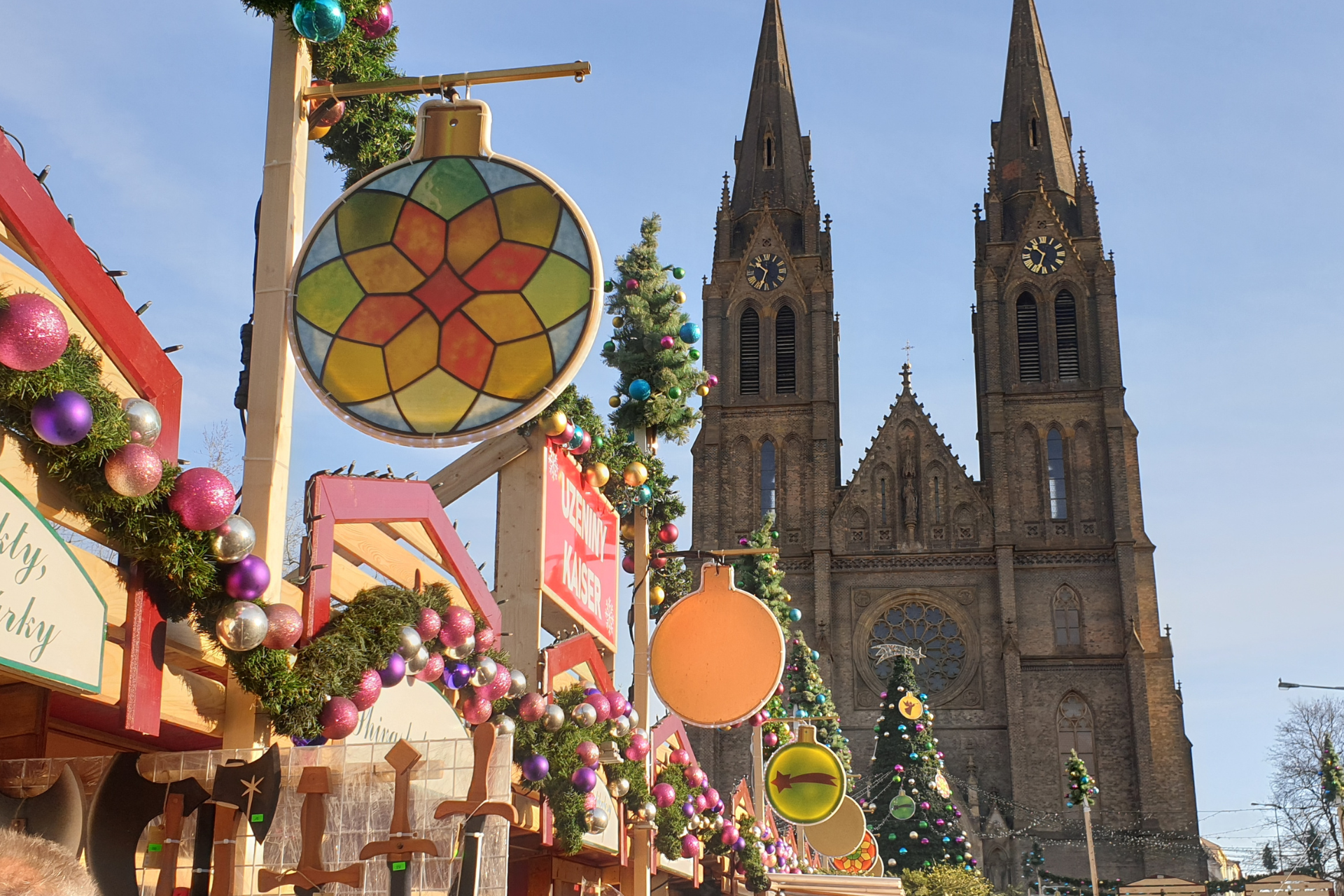 A large church with a christmas tree in front of it