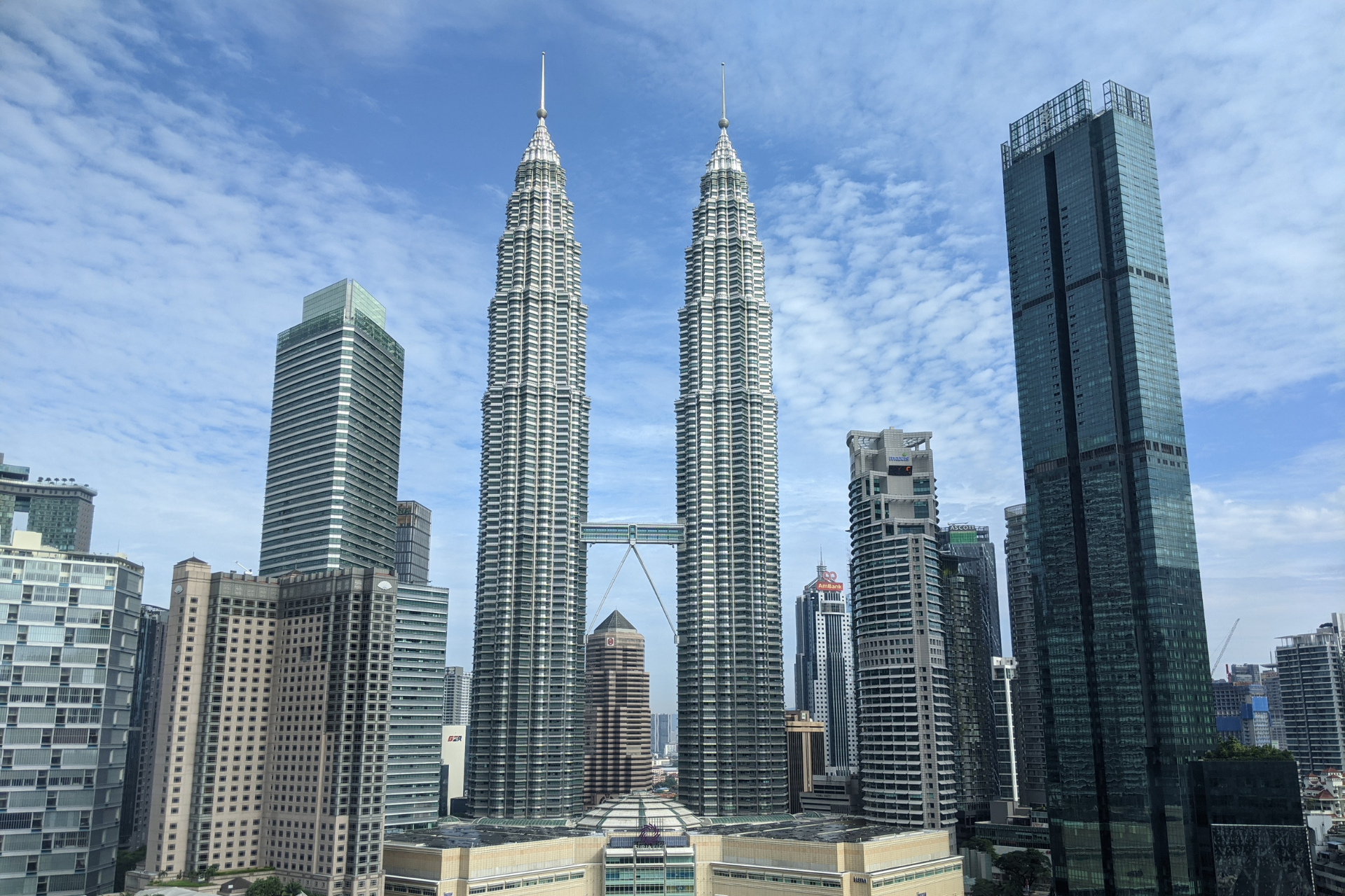 A city skyline with the twin towers in the foreground