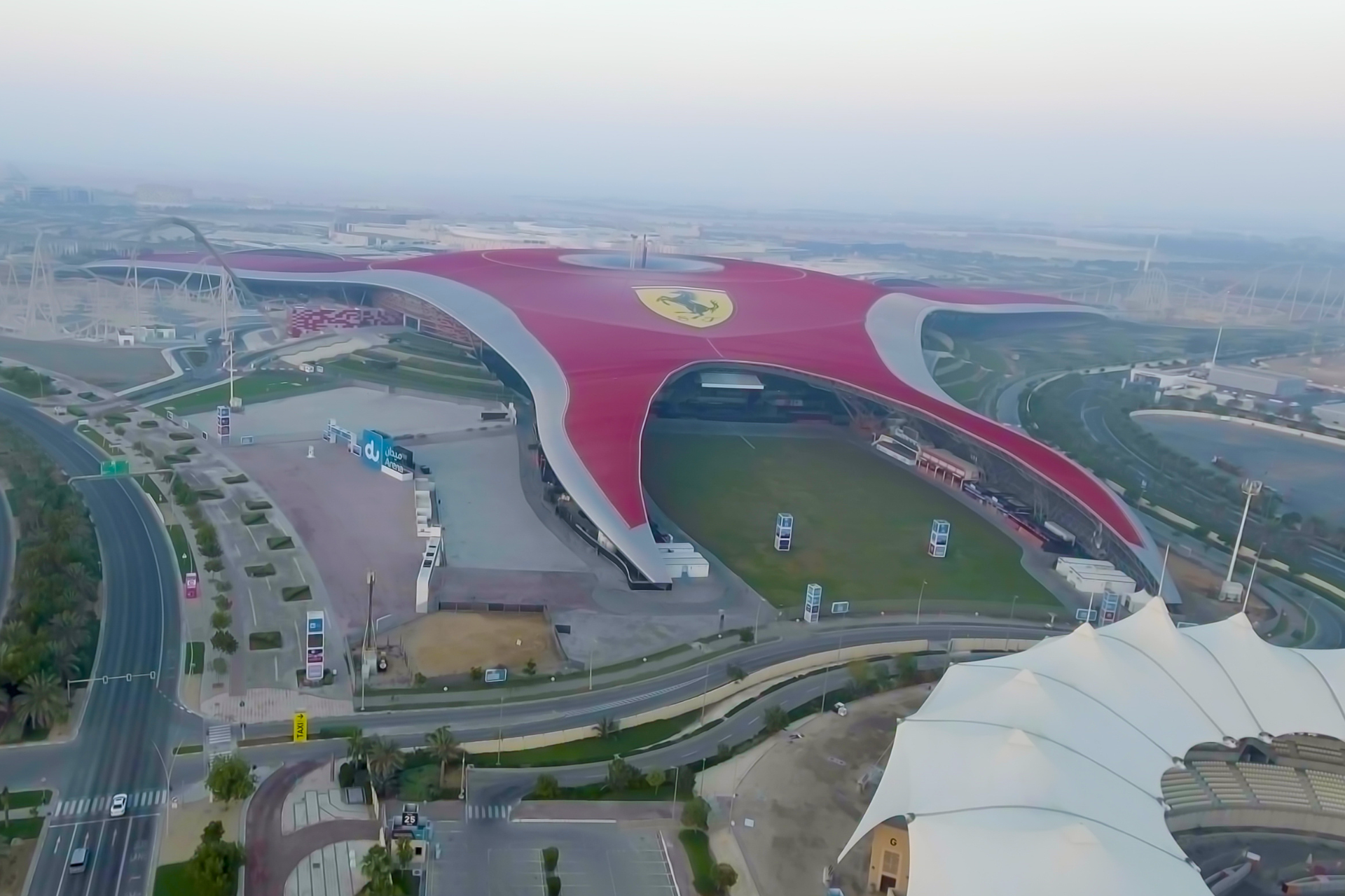 An aerial view of a large building in the middle of a city.