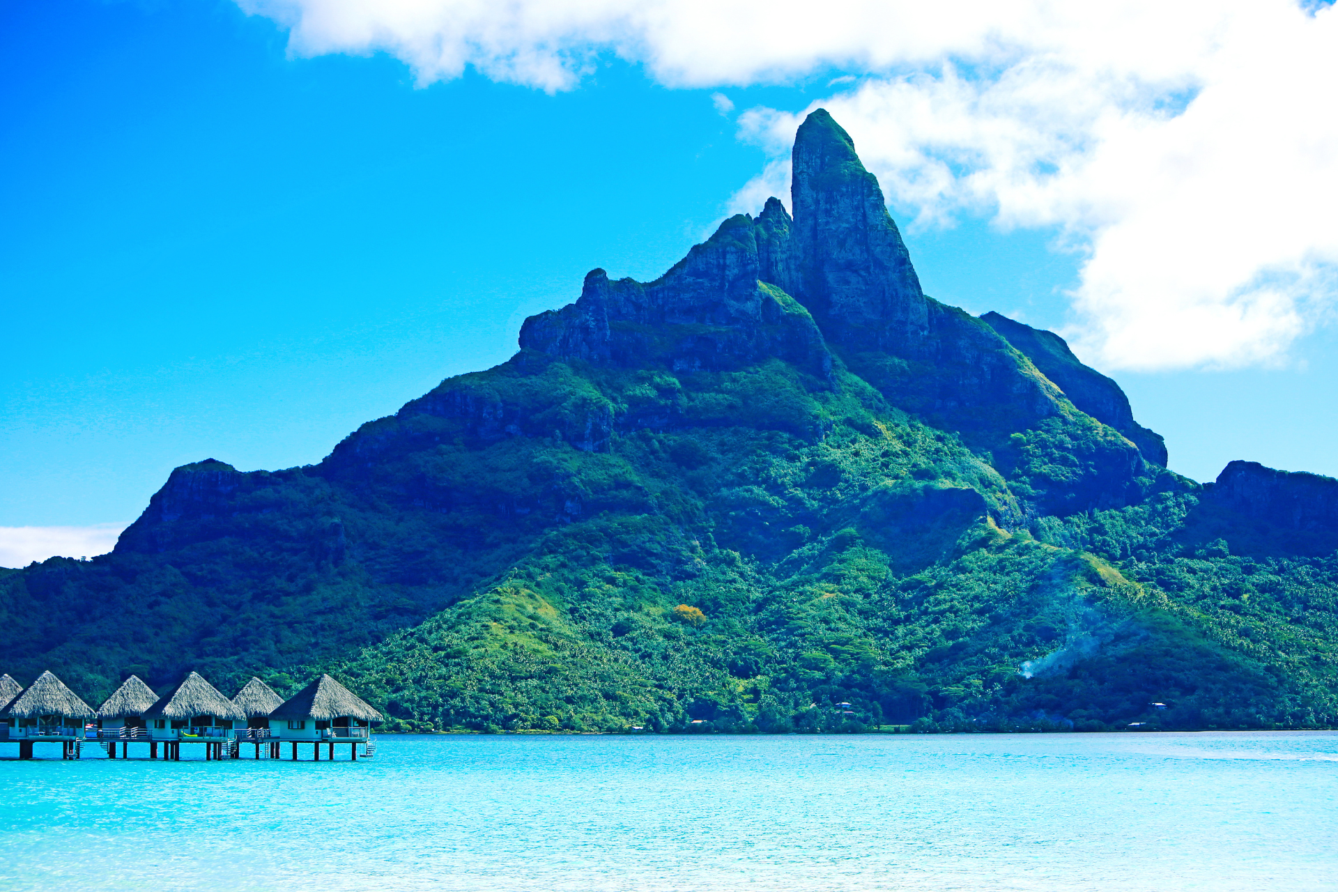 A tropical island with a mountain in the background