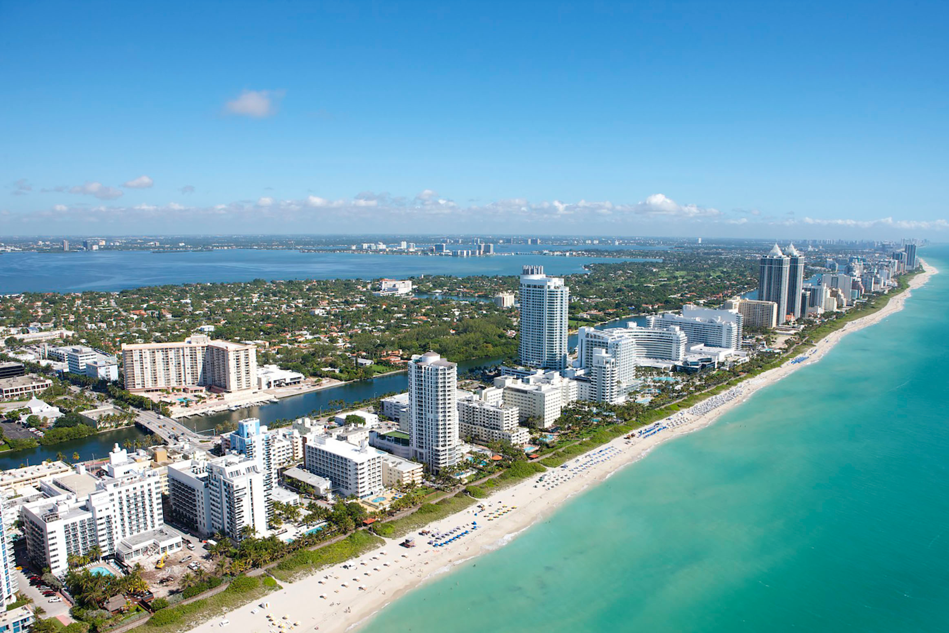 An aerial view of a city and a beach in miami florida.