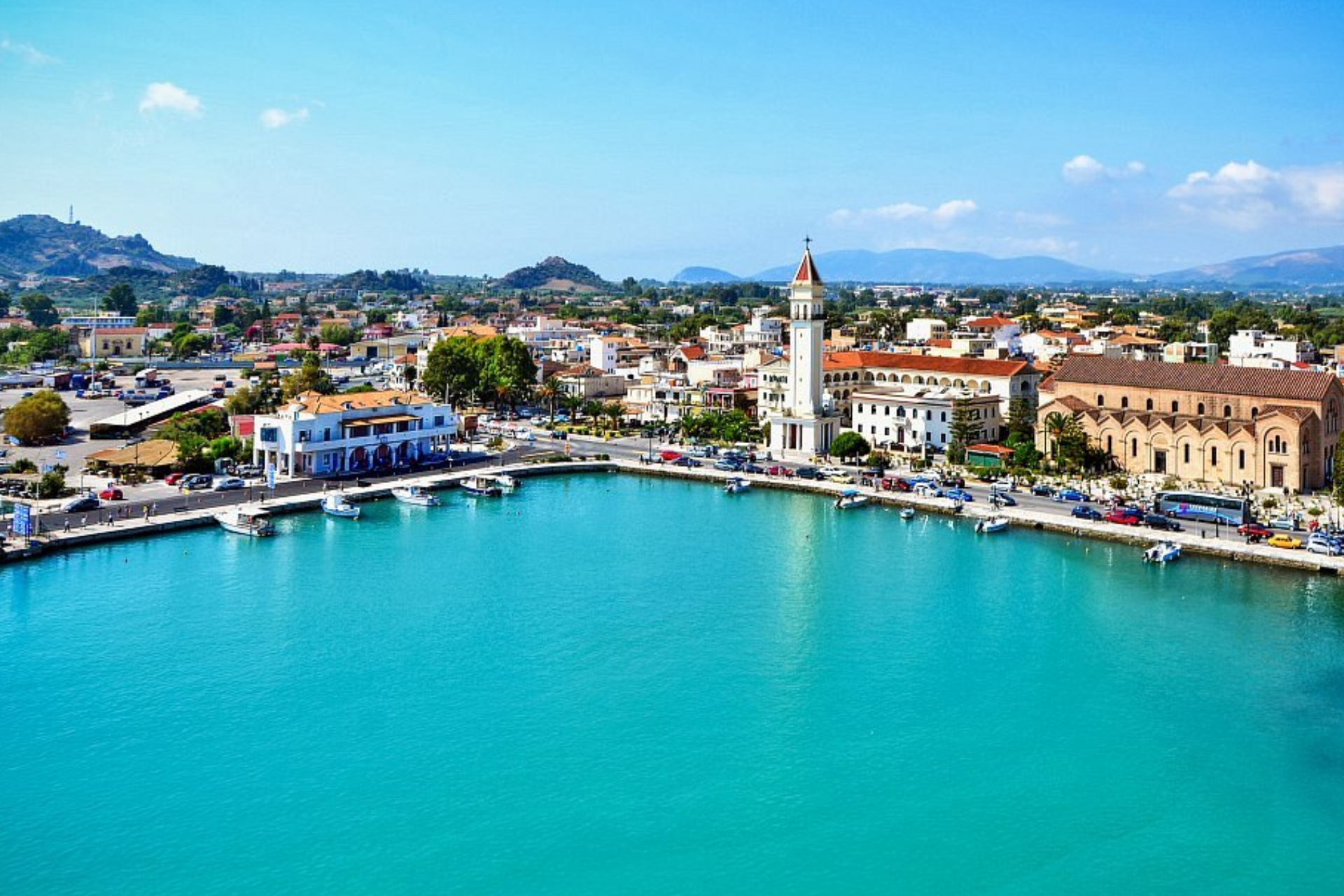 An aerial view of a city surrounded by water and buildings.