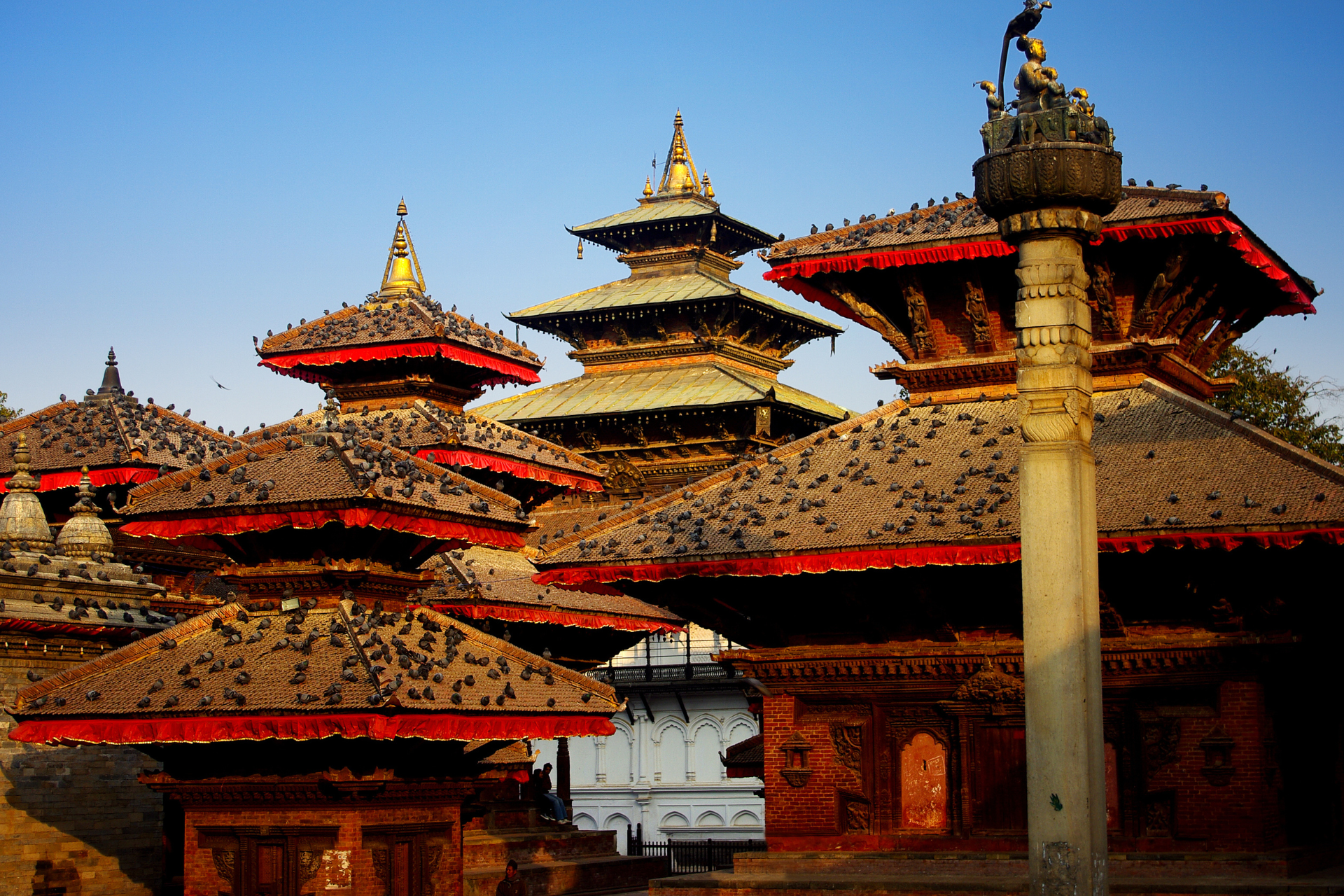 A group of buildings with a blue sky in the background