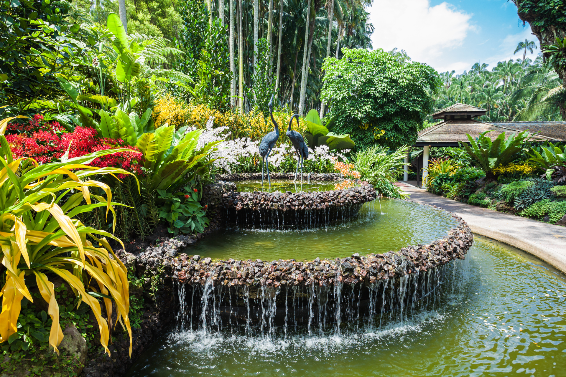 There is a waterfall in the middle of the garden.